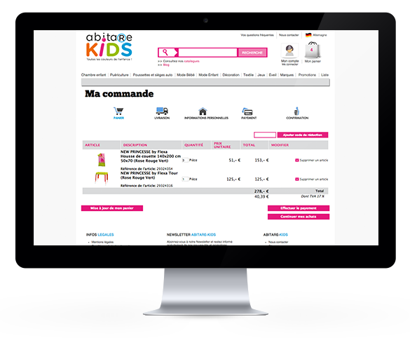 Laptop zeigt Webseite von "abitare KIDS" mit Bestellübersicht für Kinderzimmerartikel.